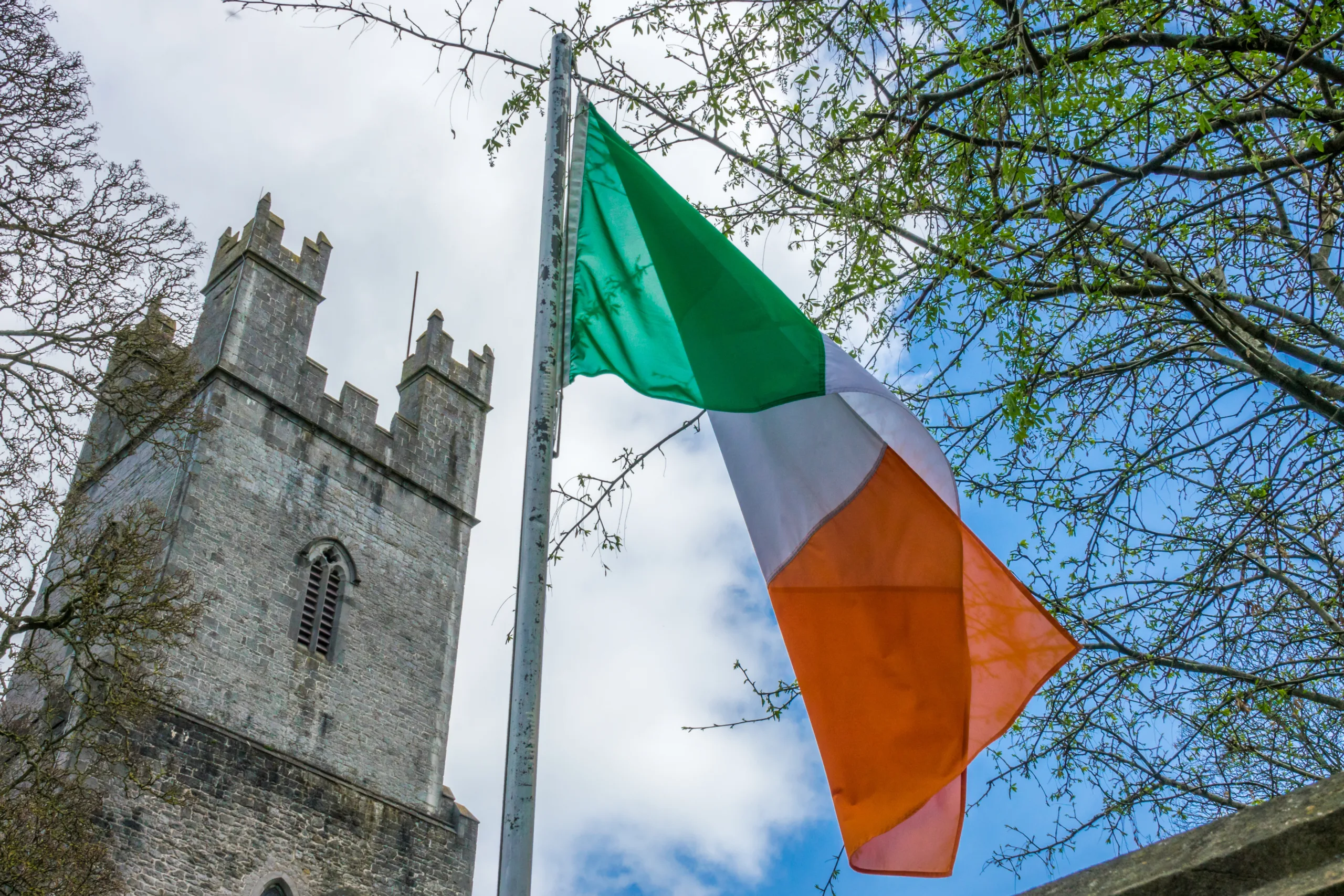 Irish,Flag,Fluttering,In,Front,Of,The,Tower,Of,An